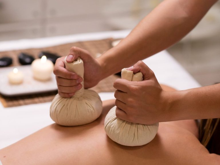 Thai Massage at Home in Marbella Person receiving a Thai massage in Marbella in a relaxing candlelit setting